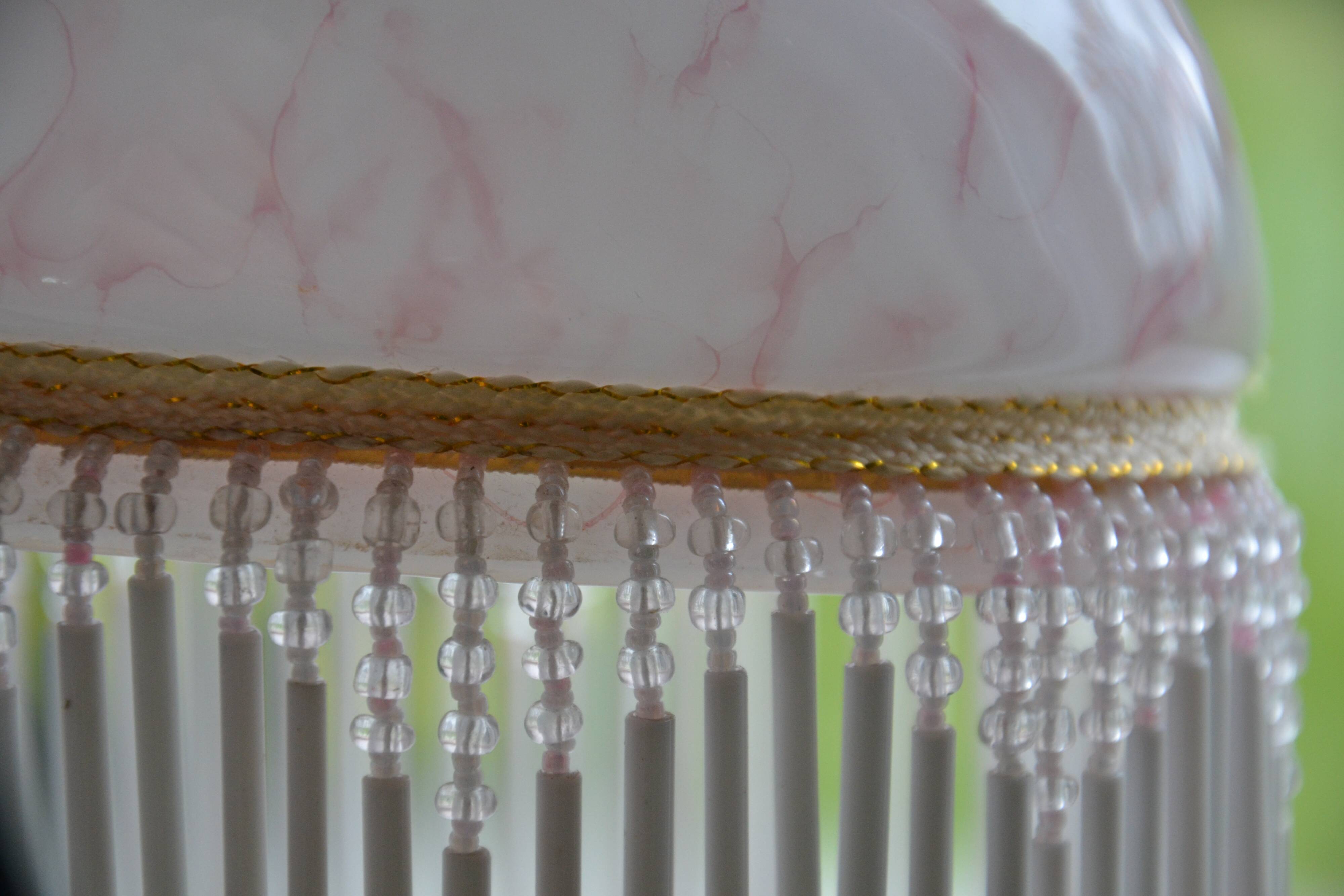 Lustrous suspension in glass paste, glass and ceramic pendants.