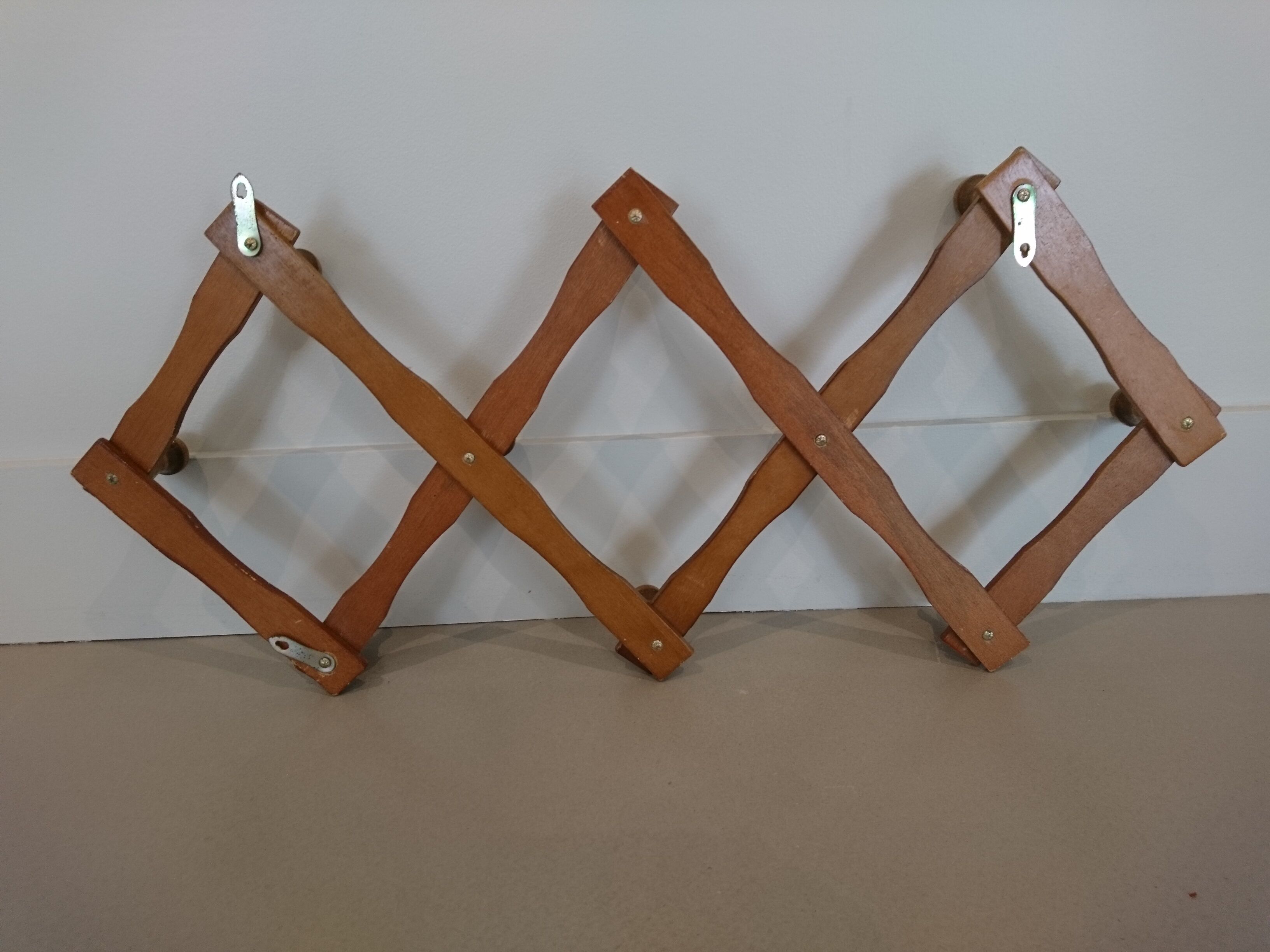 Folding wall coat rack