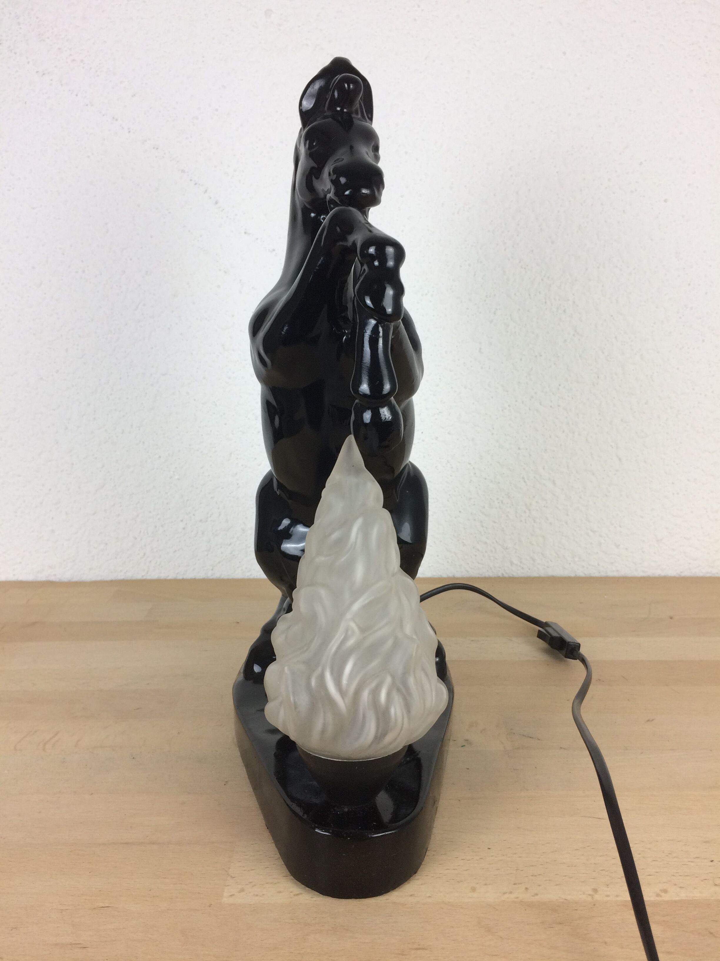 Prancing horse lamp and flame