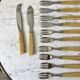Set of 12 forks and 2 dessert serving knives in horn 60s