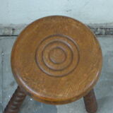 Stool in old oak, turned feet and chiseled grounds
