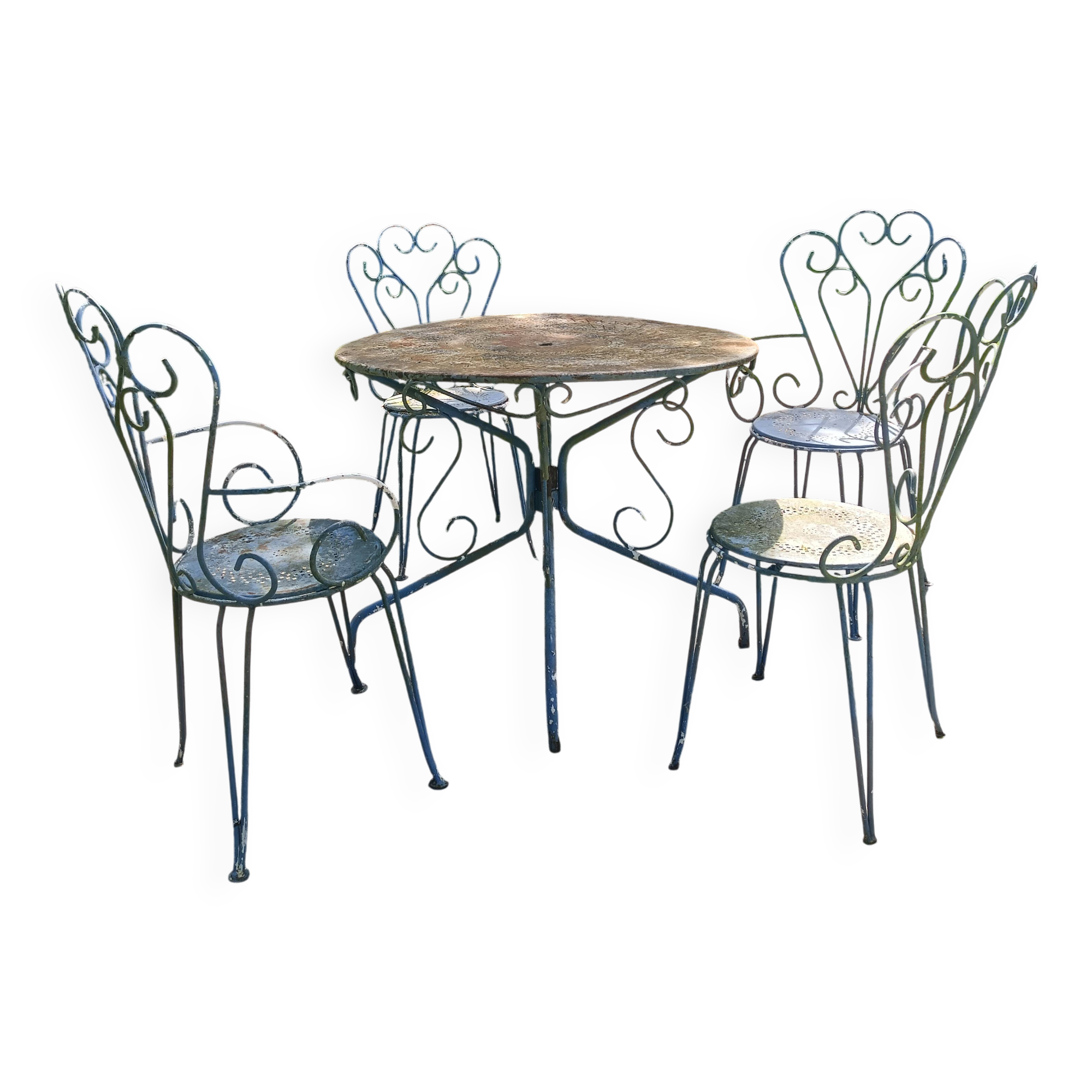Table + 2 chairs and 2 outdoor iron armchairs.