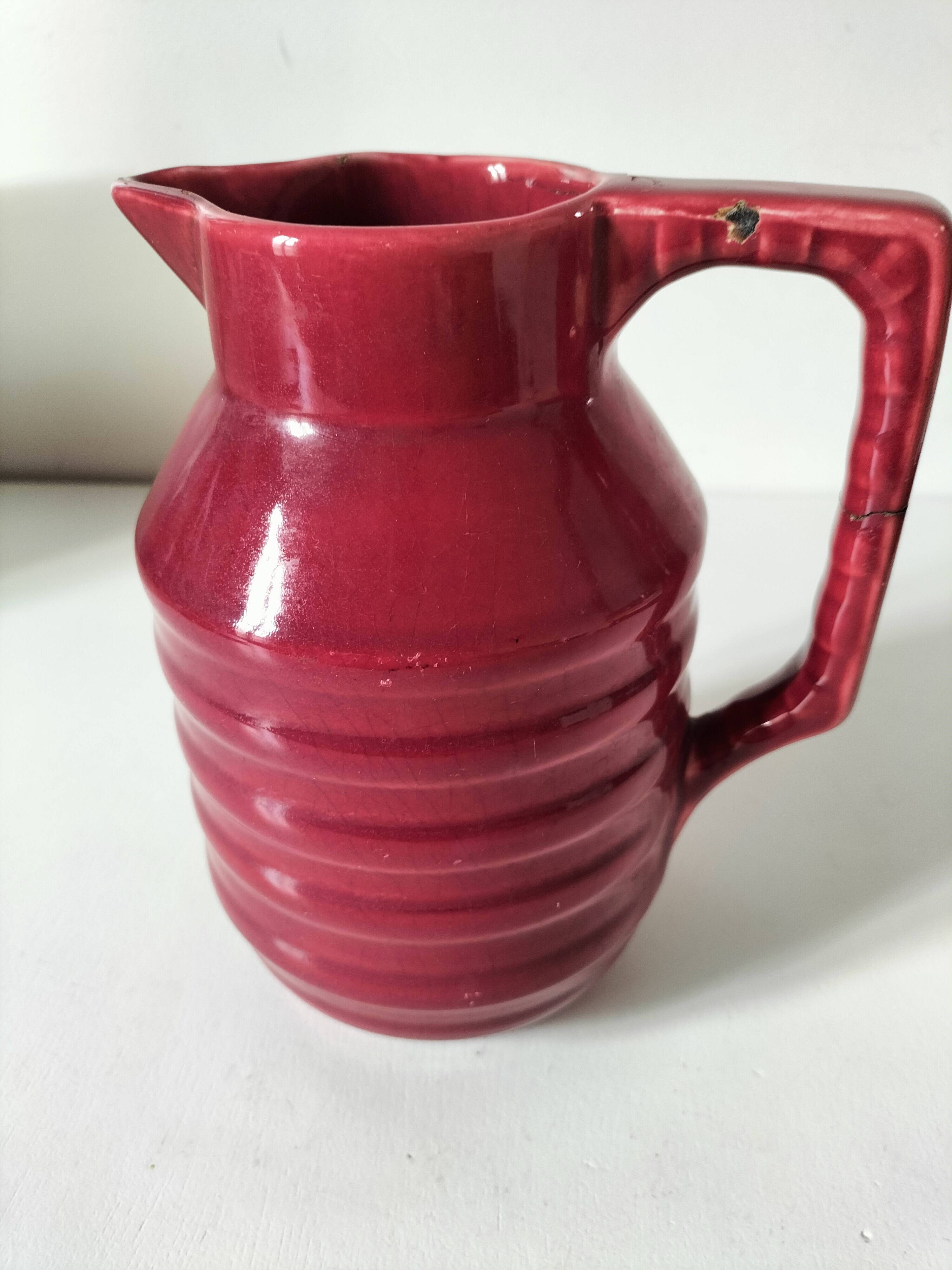 Old raspberry red pitcher from Onnaing, early 20th century.