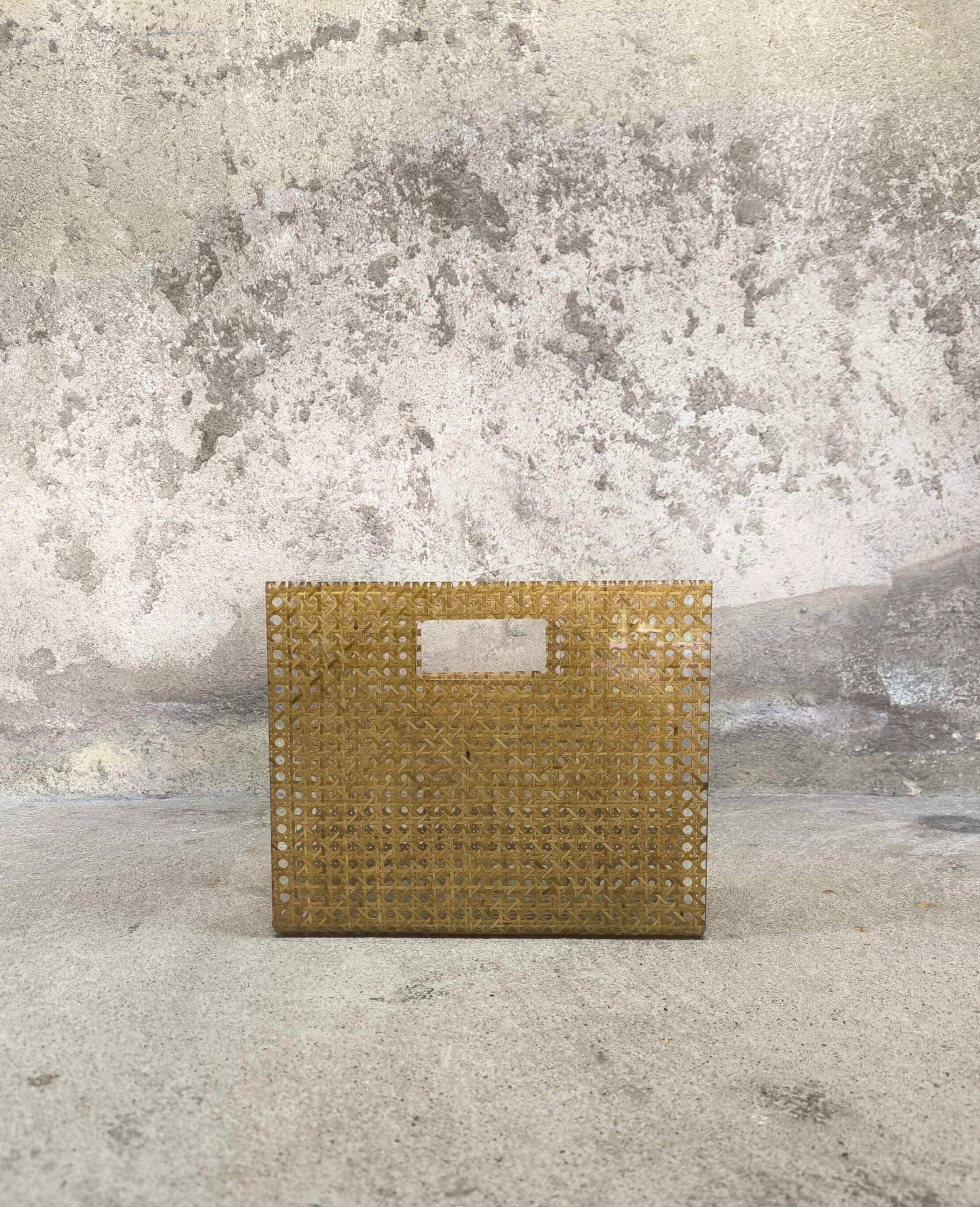 Vintage magazine rack in plexiglass and cane.