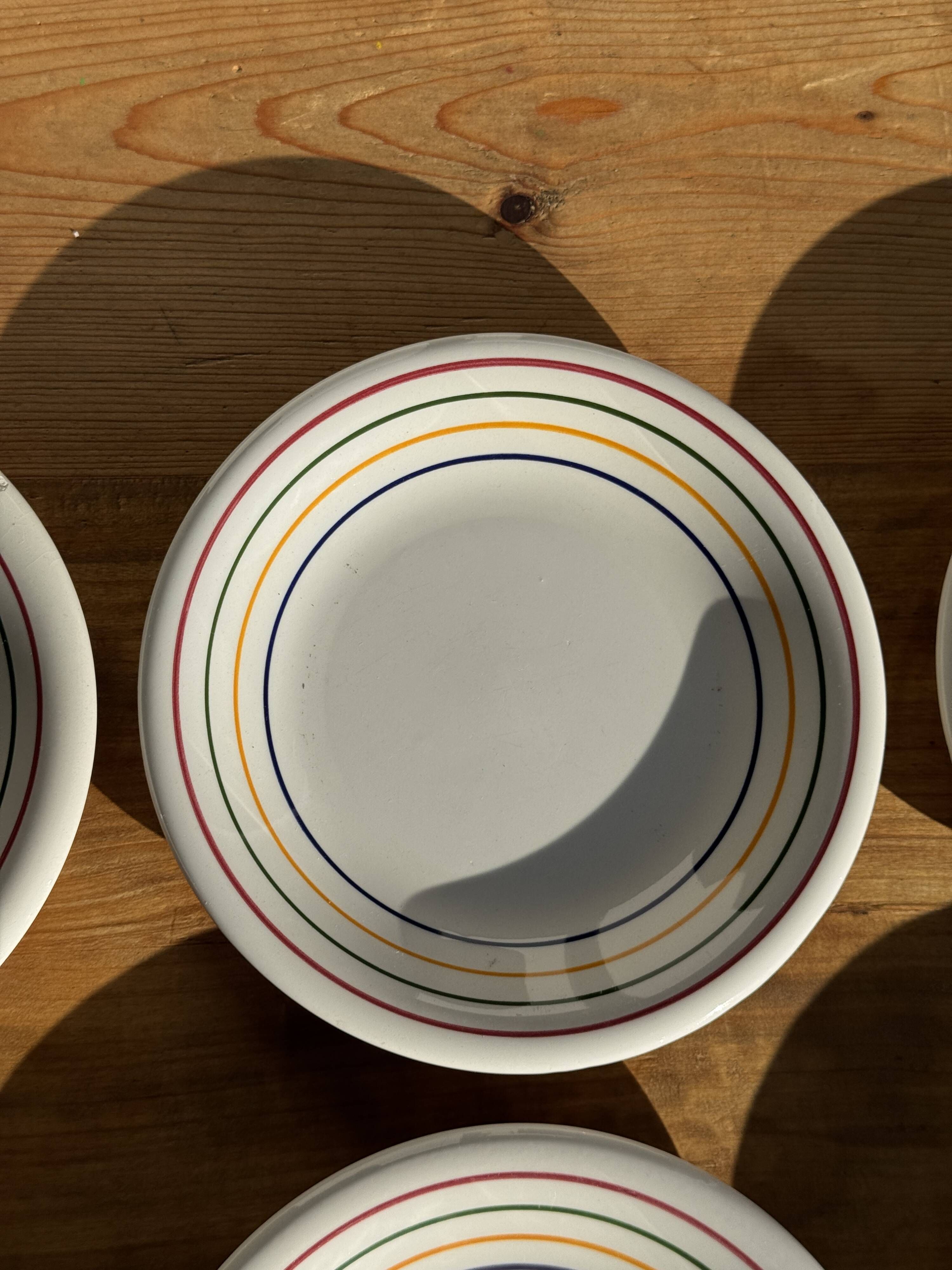Set of 9 small Italian dessert plates Primula with red and green trim.