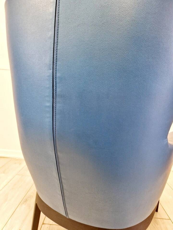 High-back armchair by Rodolfo Dordoni