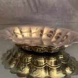 Oval-shaped polylobed metal cup with silver patina engraved with the letter D