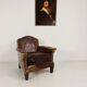 Antique leather club chair with stud detailing