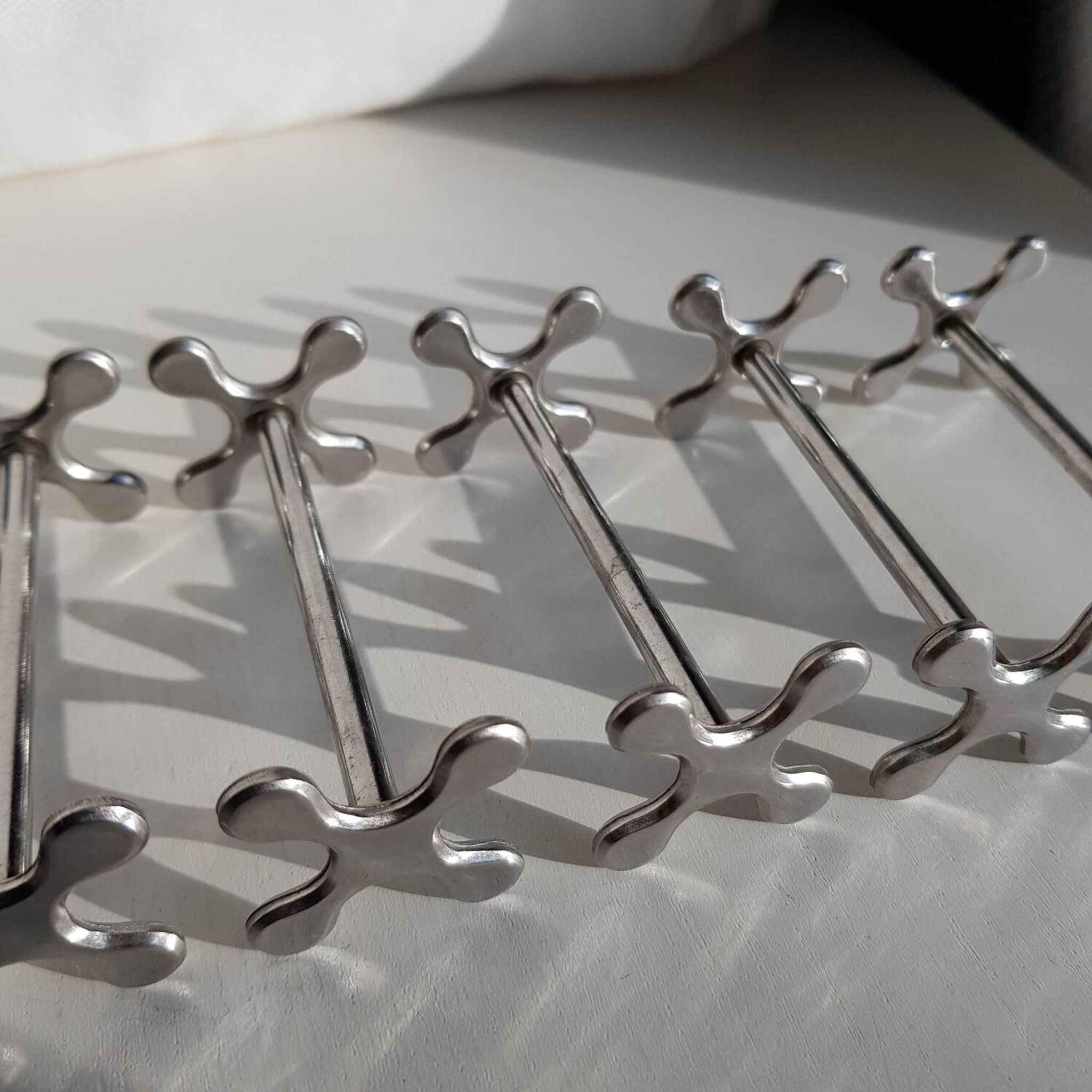 Set of 6 stainless steel knife rests by Chabanne in its original box.