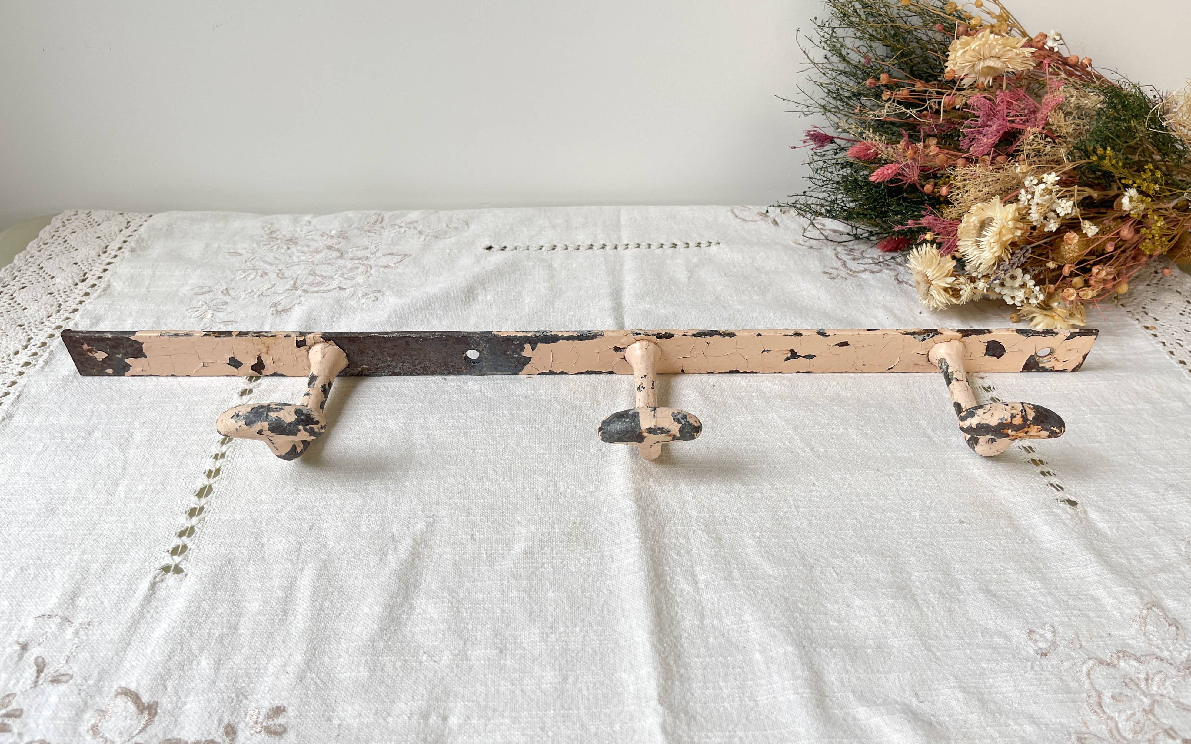Vintage enameled cast iron wall hook with 3 hooks