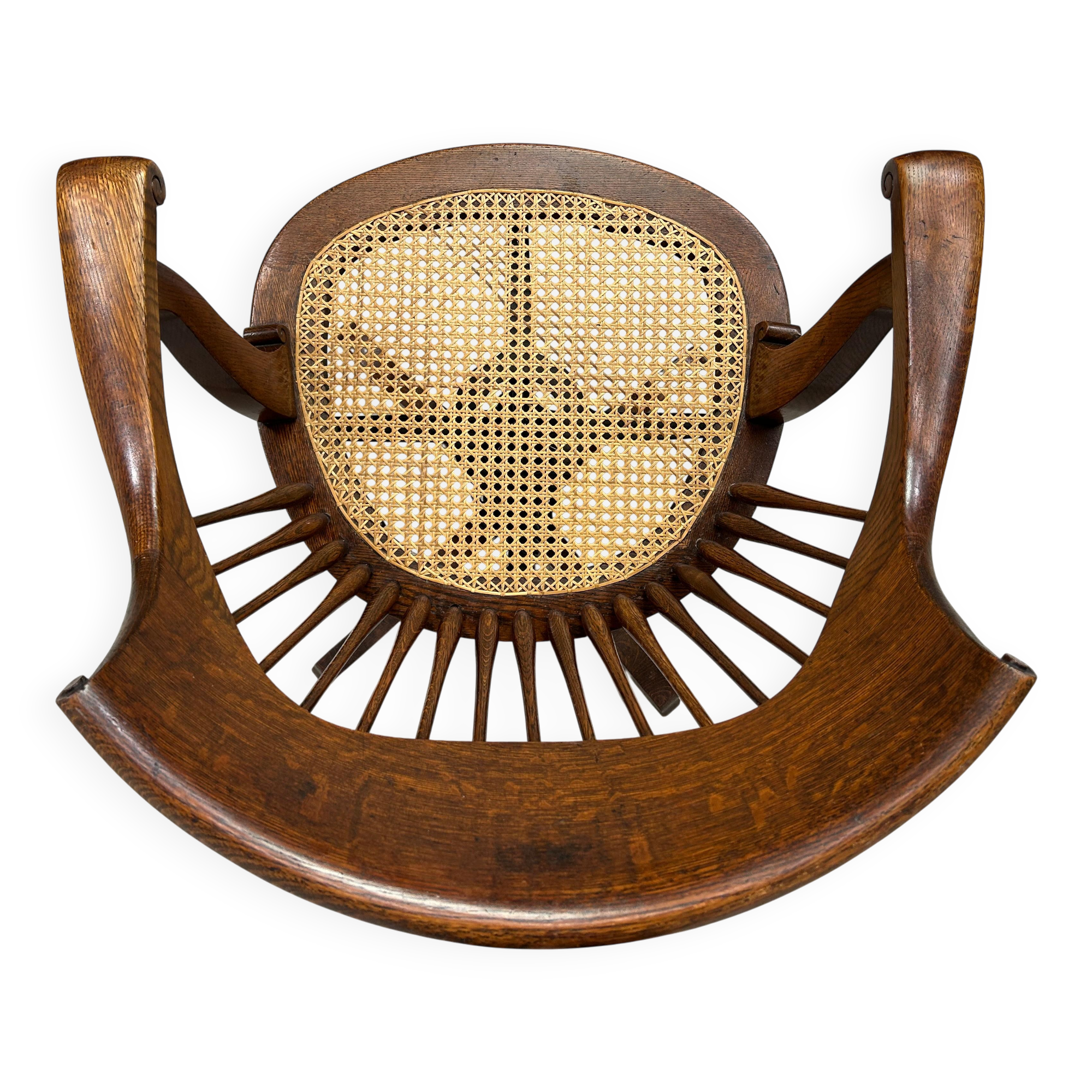 Swivel office chair in oak with a rattan seat.