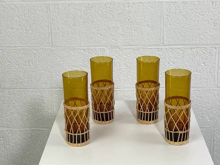 Vintage service for orangeade in amber glass and wicker.