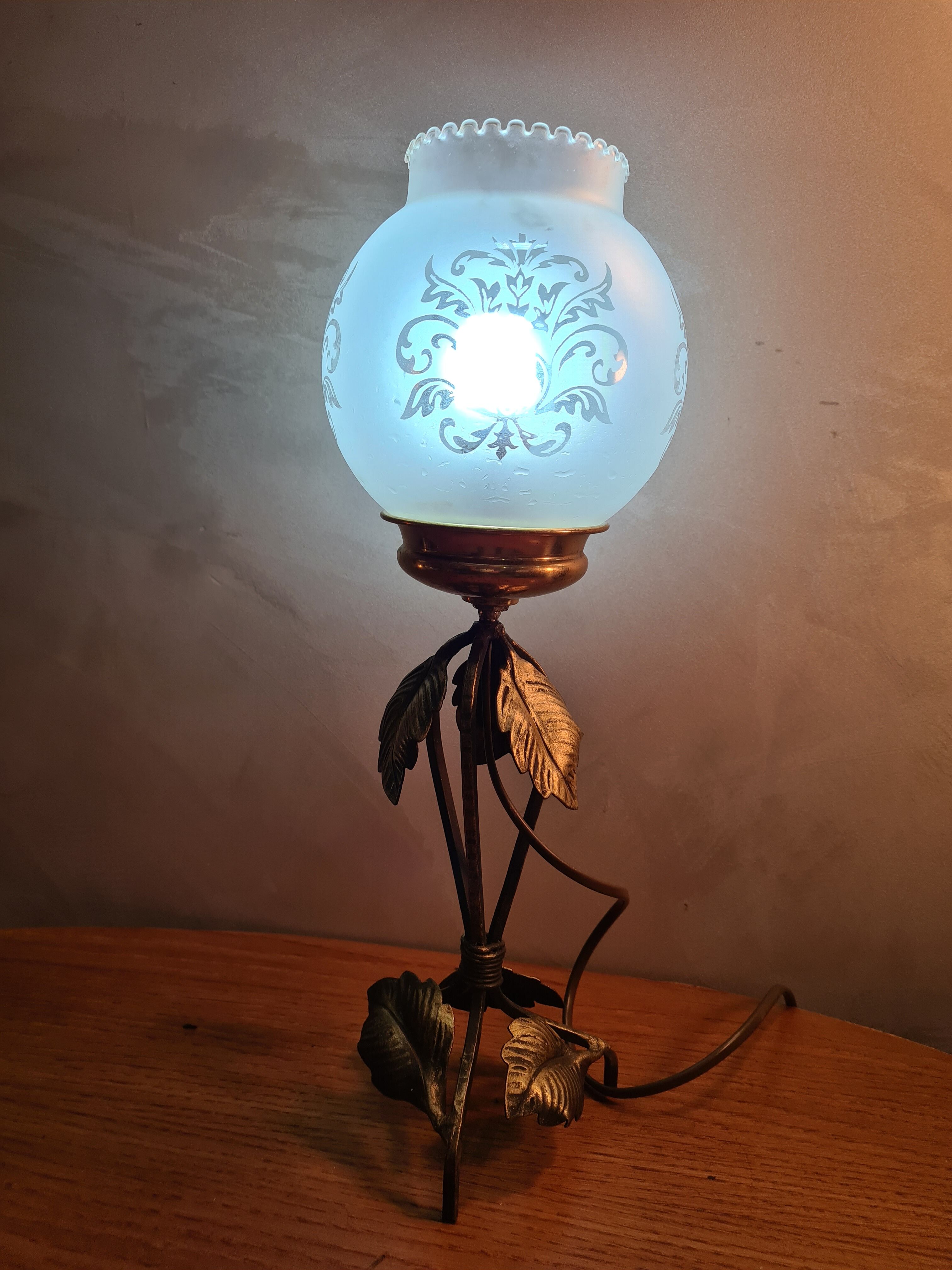 Wrought iron lamp art deco patinated gold with its opaque glass decorer pattern 40x14