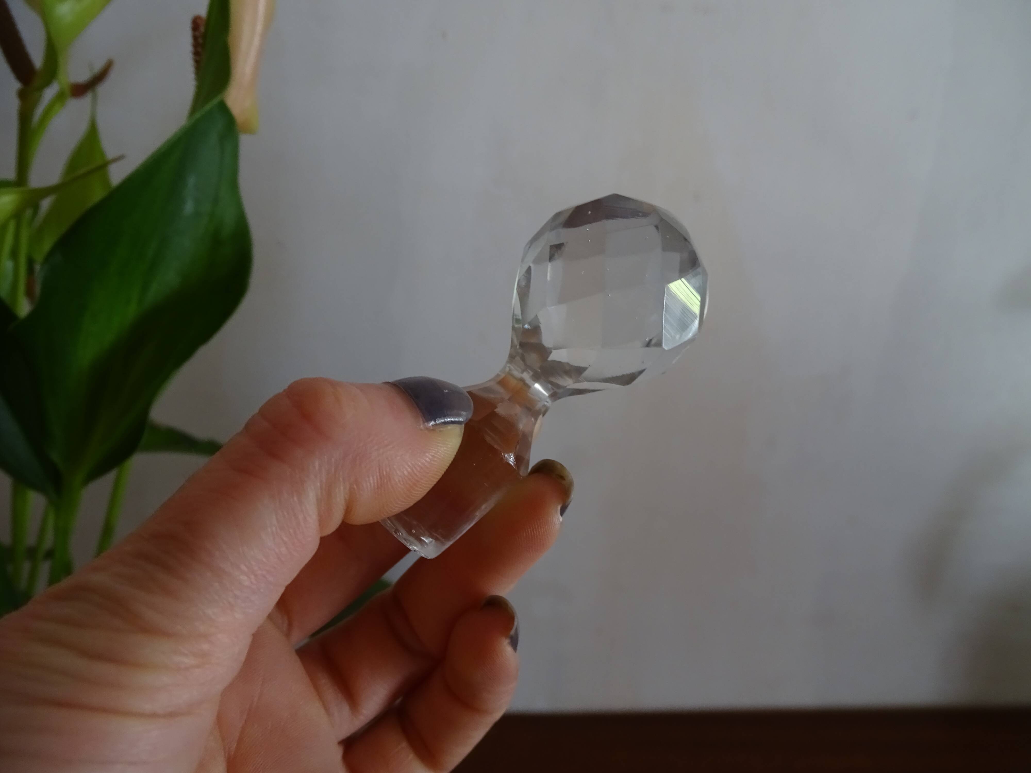 Old carafe enamelled with glass flowers