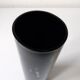 Black opaque glass vase with minimalist style copper inlays