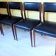 Four antique Scandinavian-style chairs made of solid wood and faux leather.