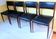 Four antique Scandinavian-style chairs made of solid wood and faux leather.