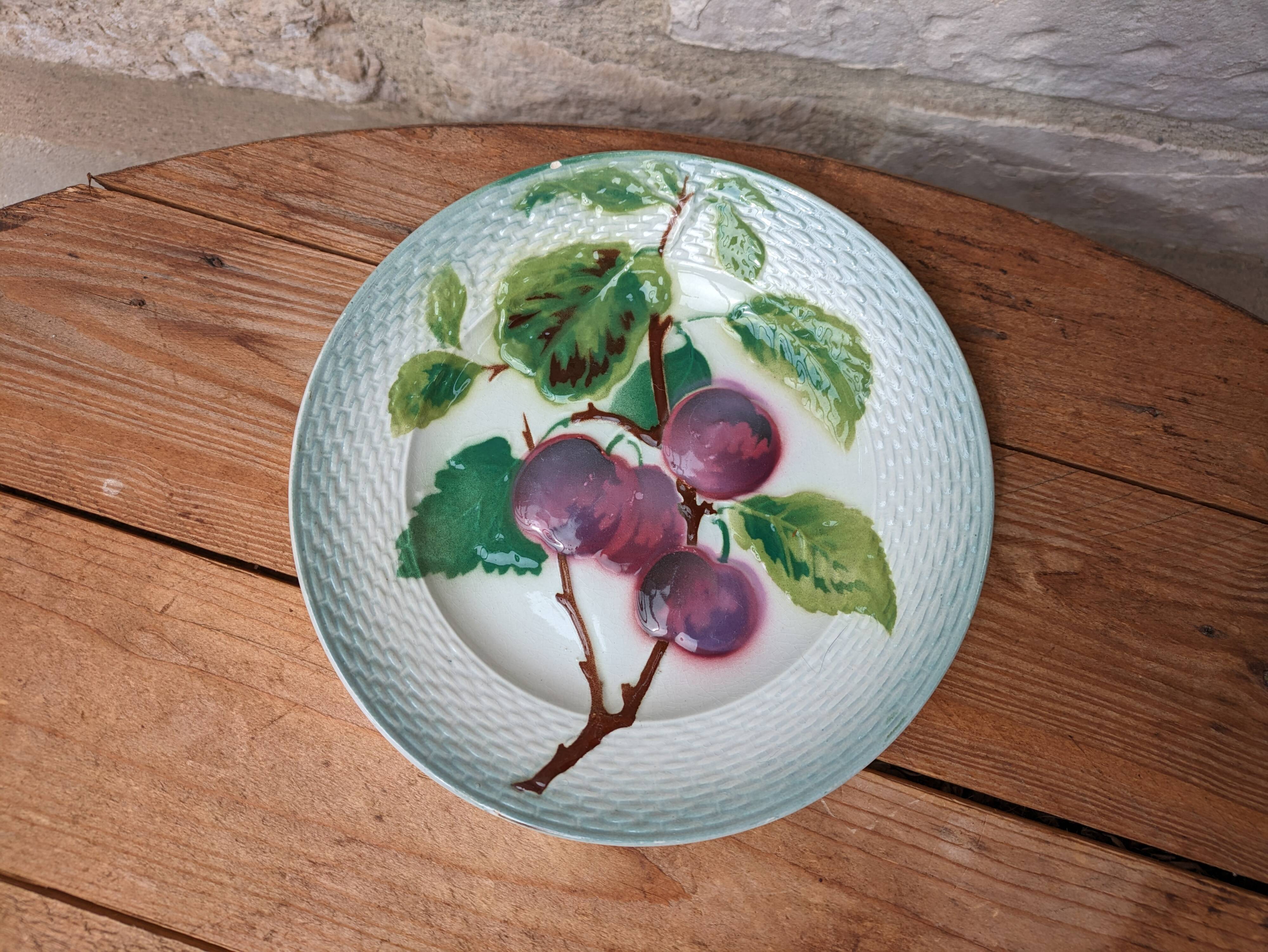 Old barbotine plate with plum motif Saint Amand Hamage