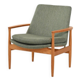 Scandinavian oak and sage-green wool armchair