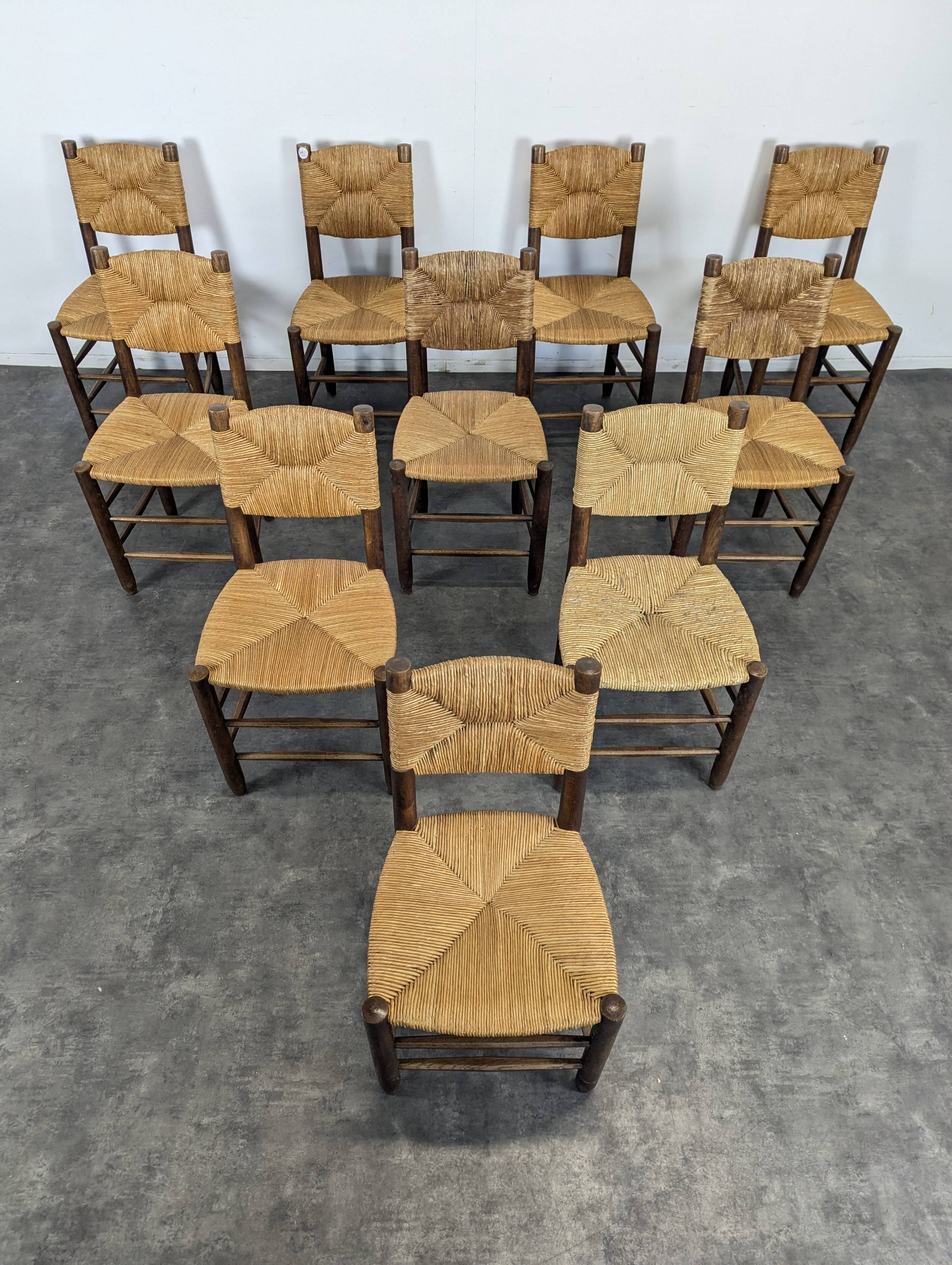 Série de 10 chaises modèle Bauche par Charlotte Perriand, circa 1960