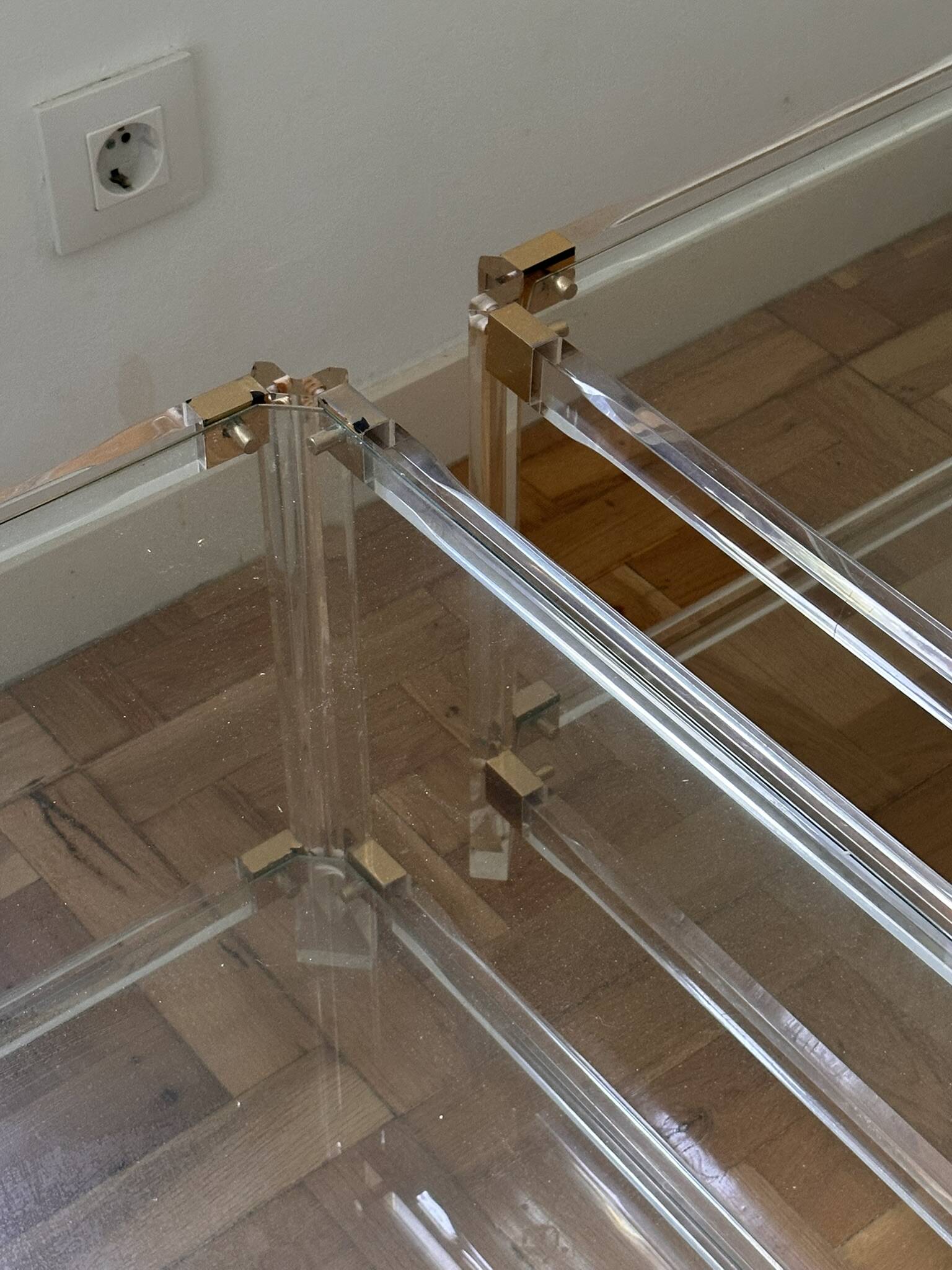 2 side tables in plexiglass, glass, and brass.