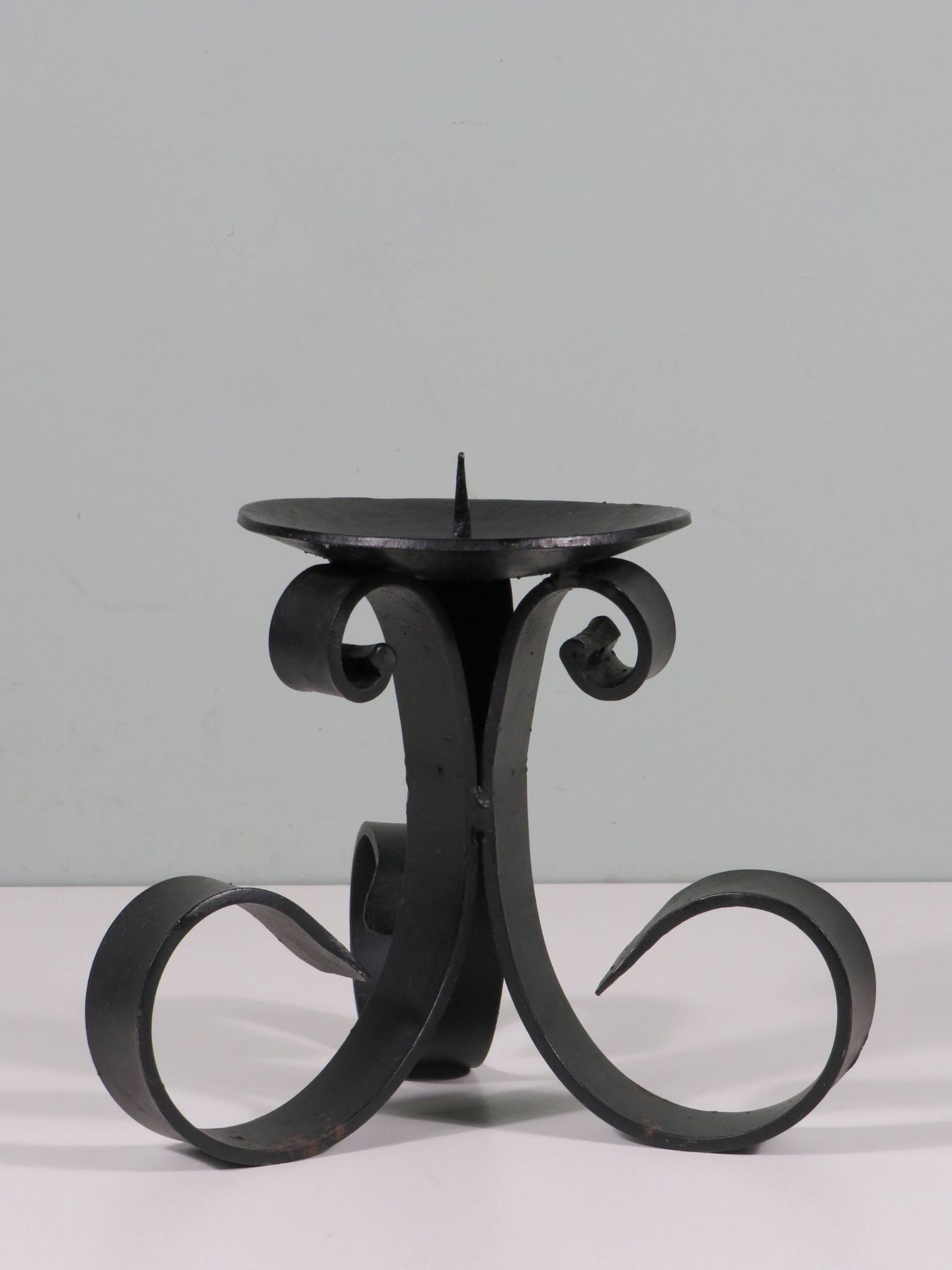 Vintage wrought iron chandelier for large candle.