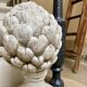 Ornamental artichoke in bleached concrete
