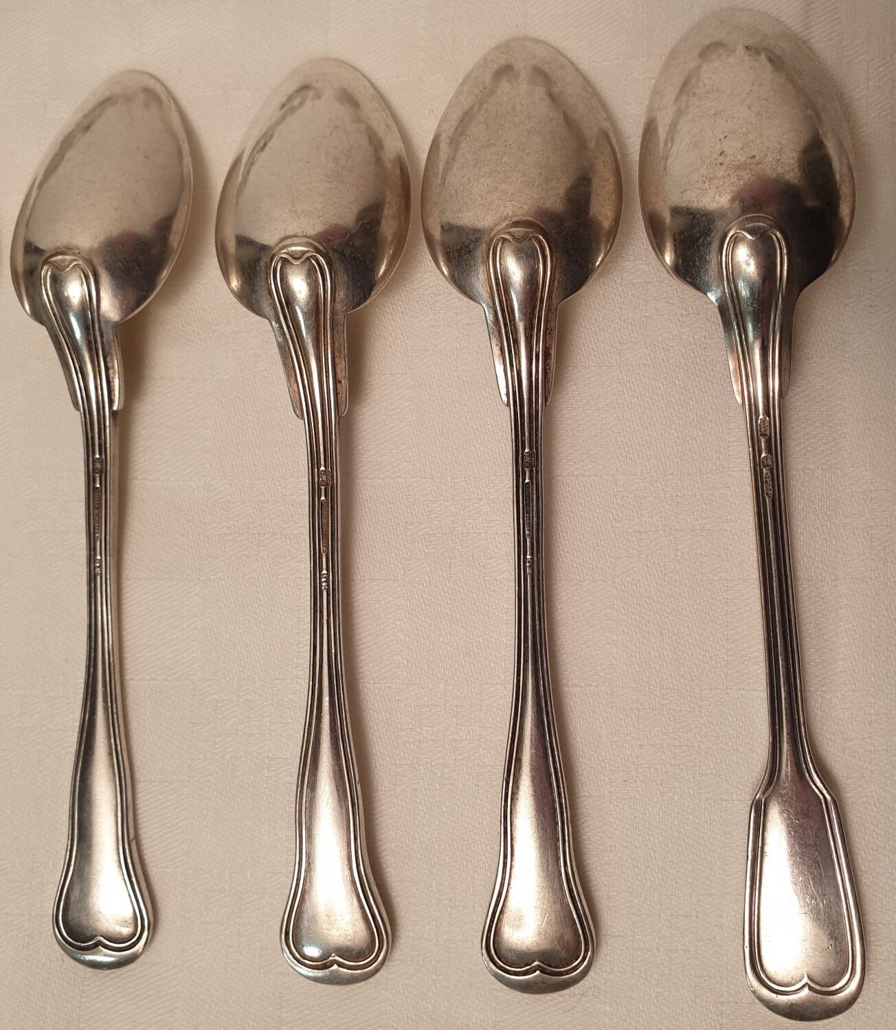 Set of mismatched silvered metal cutlery