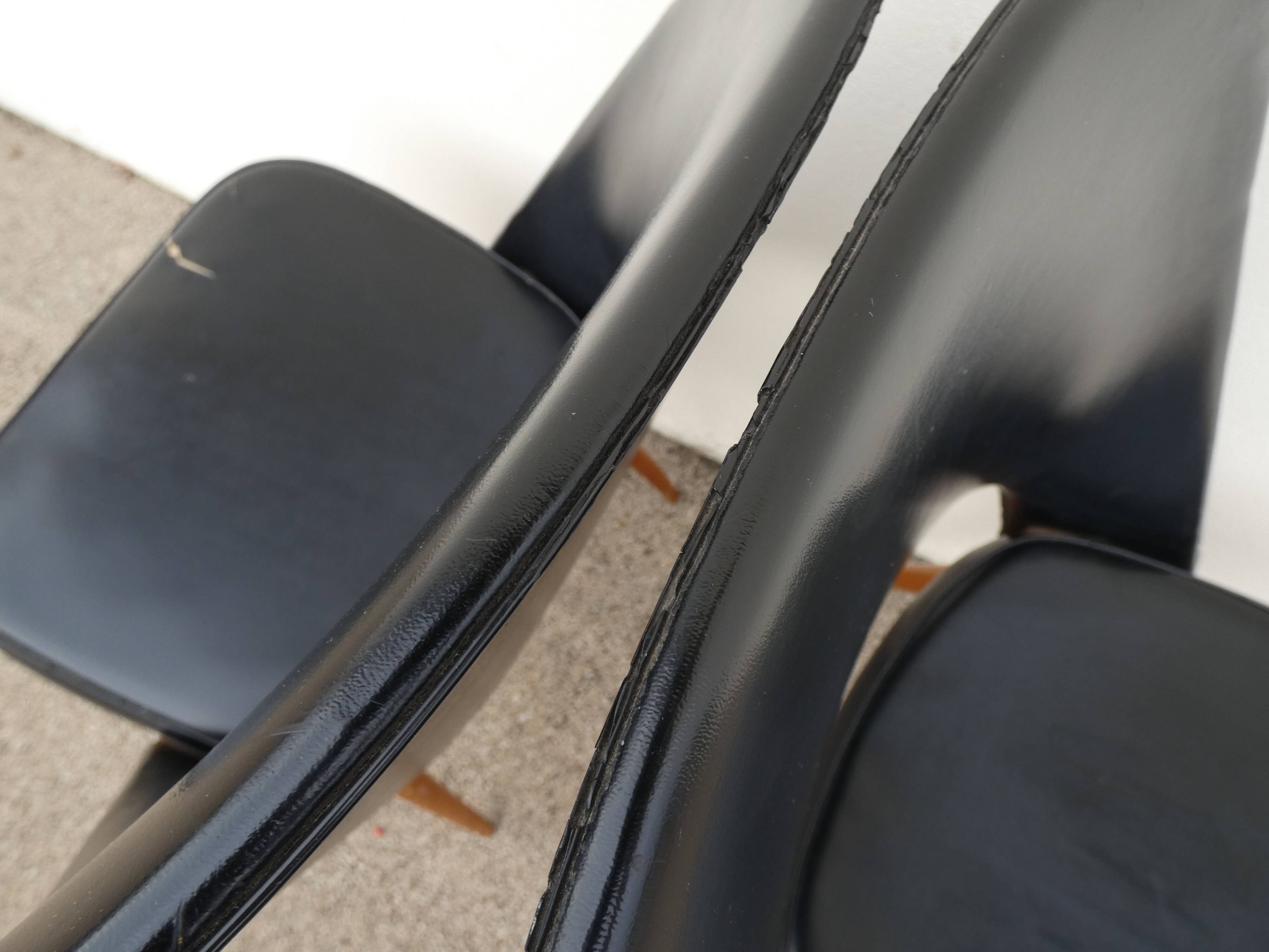 2 chairs in black skai compass legs Louis Paolozzi