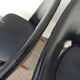 2 chairs in black skai compass legs Louis Paolozzi