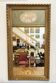 Antique trumeau mirror in gilded stucco – floral decoration