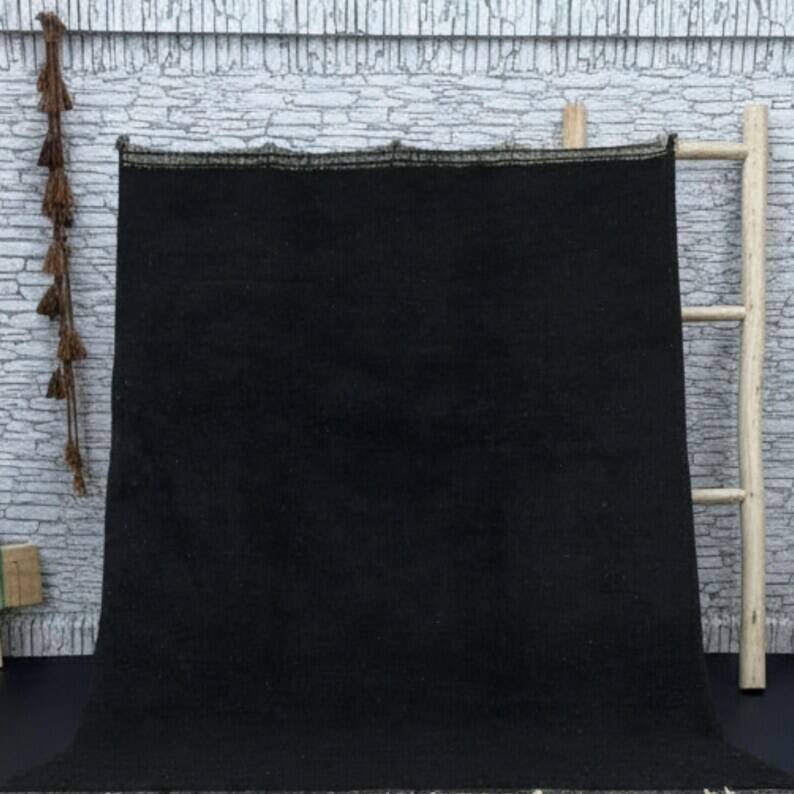 Simple black handmade wool rug 250cm x 150cm