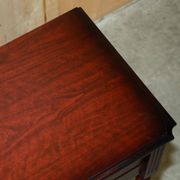Small console with two drawers in hardwood finish.