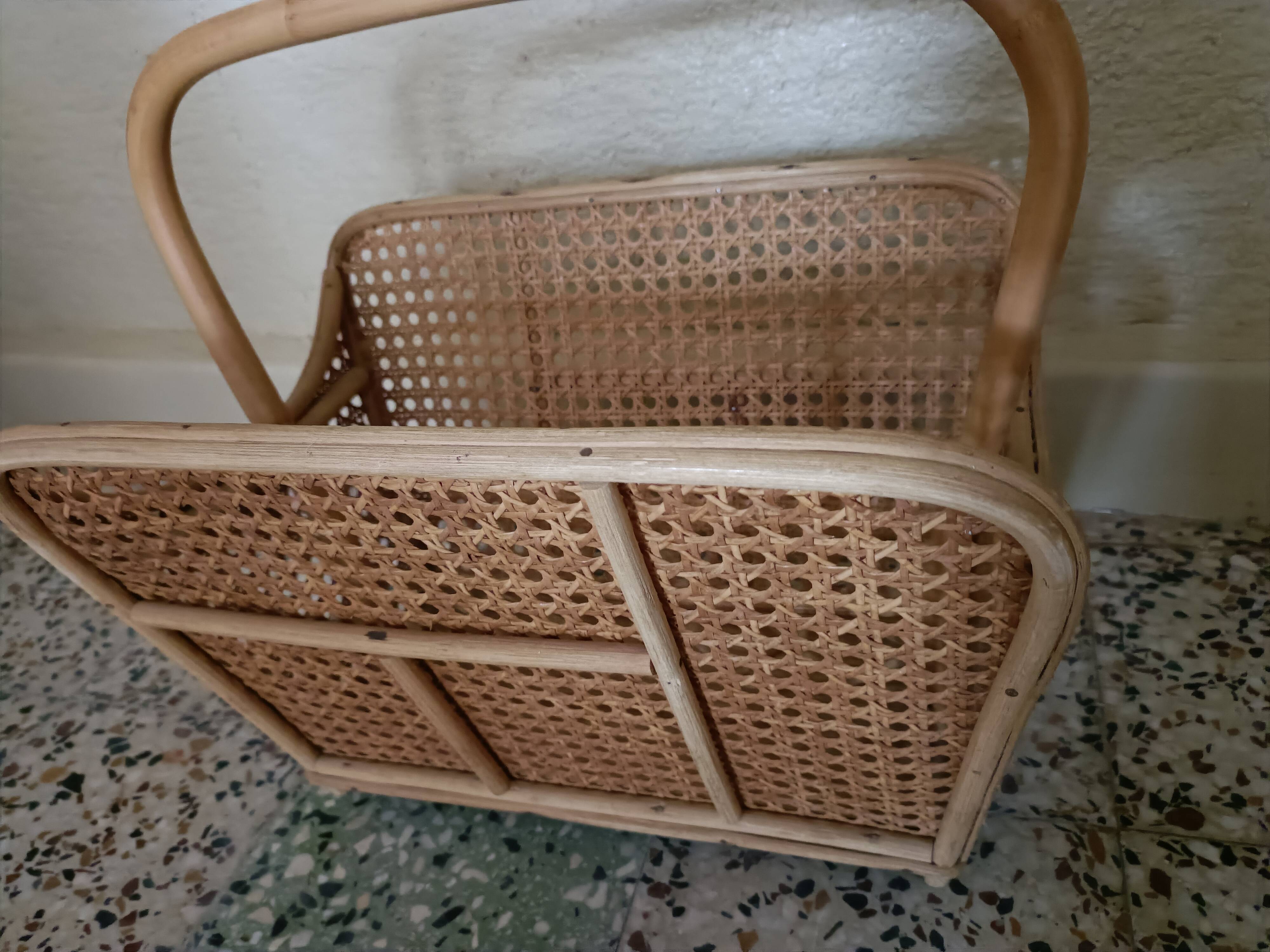 Caned magazine rack