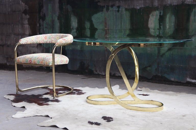 Brass ribbon console table Design Institute of America