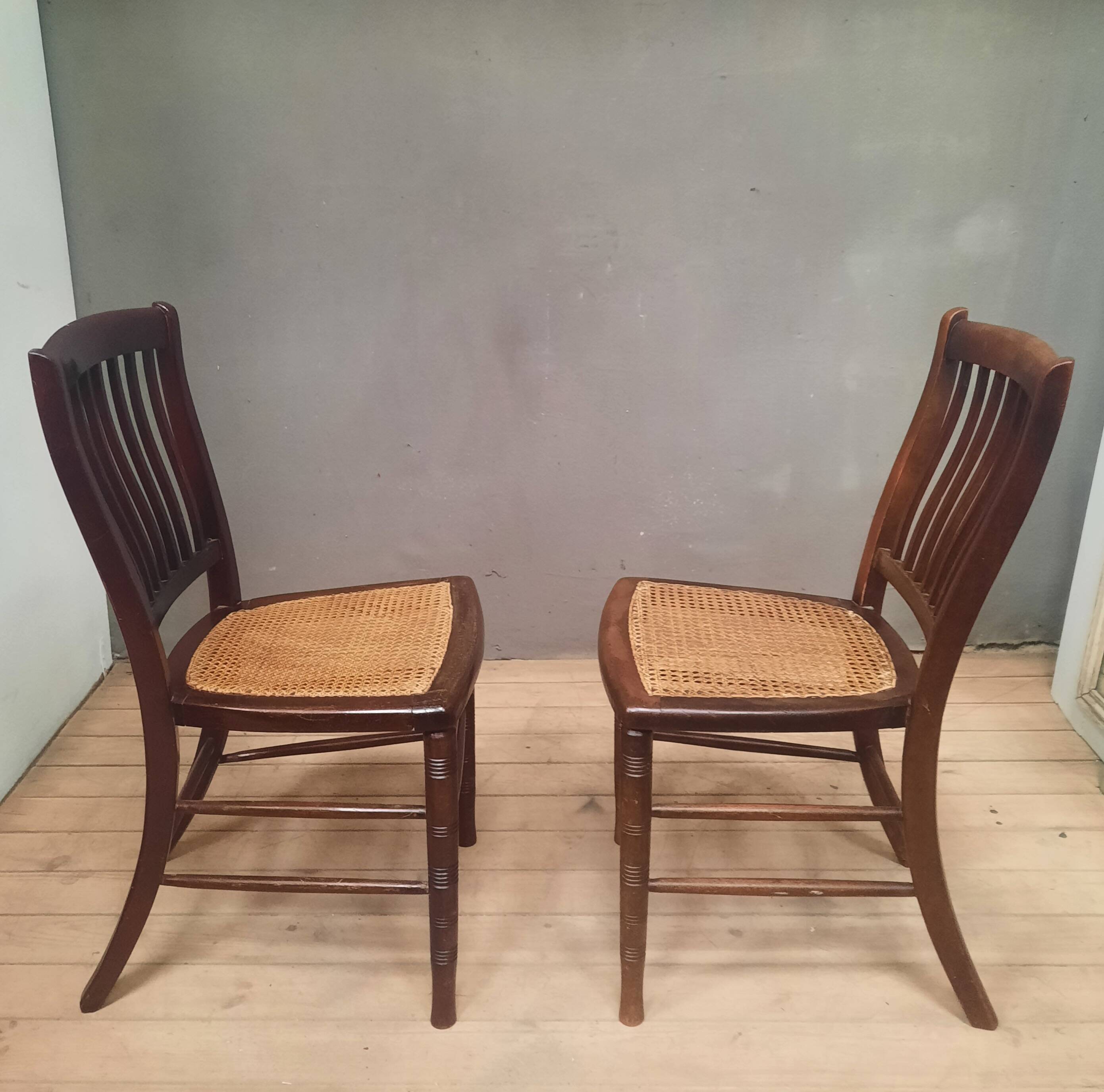 Pair of "1900" caned chairs