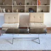 70s design coffee table with a black top and steel legs.