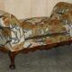 Antique banquette with cluster and ball feet, window seat in Mulberry Flying Ducks fabric.
