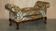 Antique banquette with cluster and ball feet, window seat in Mulberry Flying Ducks fabric.