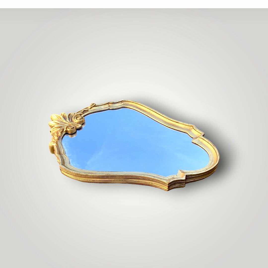 Vintage wall mirror with golden resin shell