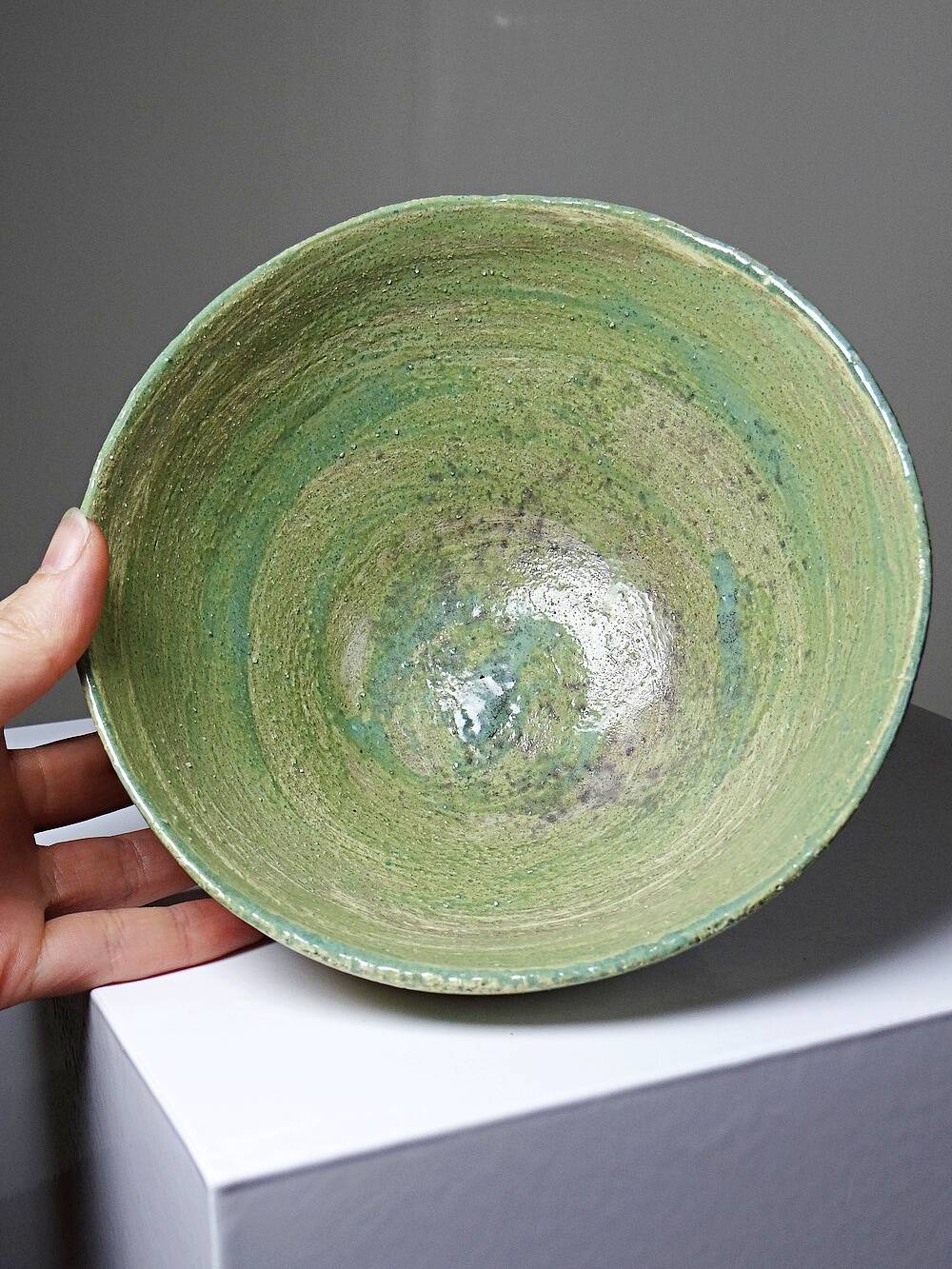 Wabi-Sabi handcrafted ceramic bowl in celadon green, 20th-19th century.