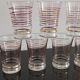 Set of 7 vintage glasses with gold and red edges from the 50s/60s