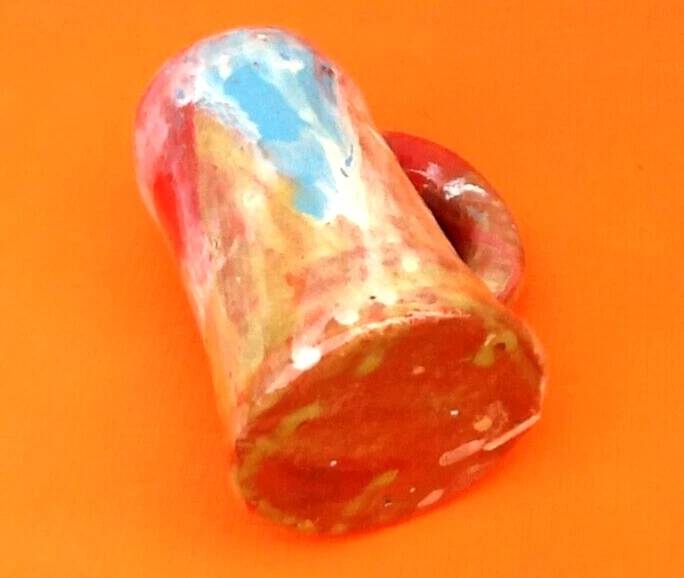 Traditional ceramic mug with a marbled glaze effect.