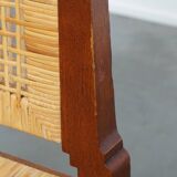 4 wooden Art Deco design dining chairs with a wicker seat and backrest