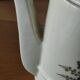 Small coffee maker with floral decoration