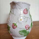 Barbotine pitcher with pastel flower decoration