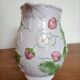 Barbotine pitcher with pastel flower decoration