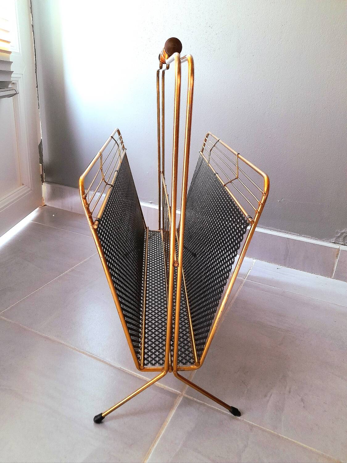 Perforated metal magazine rack 1950