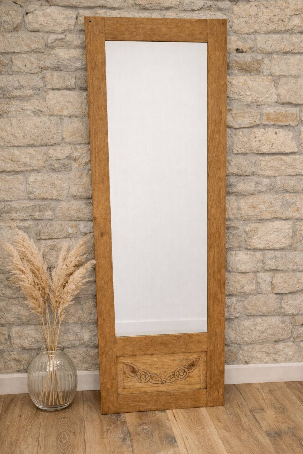Restored old wardrobe door in a cheval mirror / freestanding mirror.