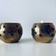 Pair of brass and glass tealight holders